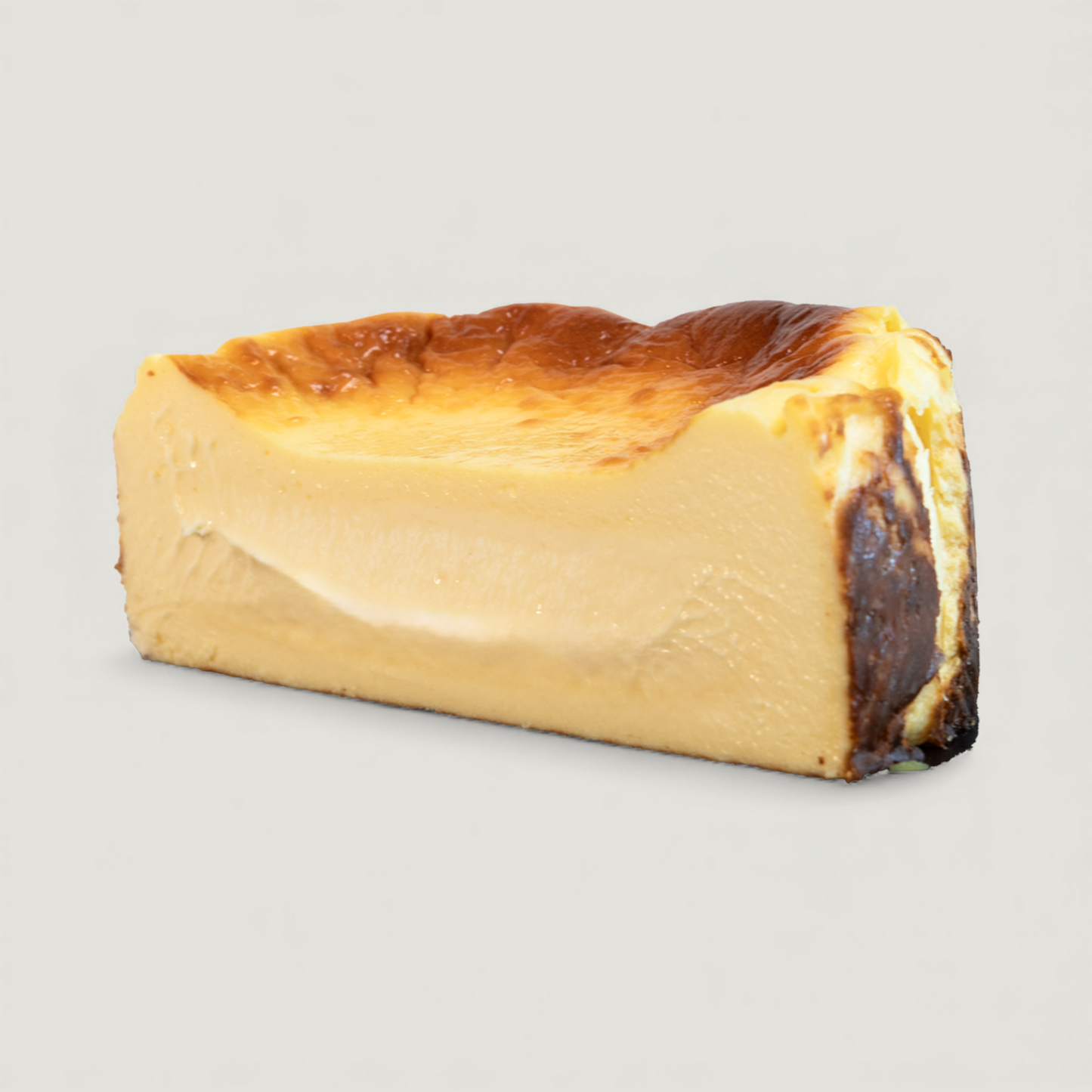 Classic Basque cheesecake cut with caramelized top, handmade in San Diego